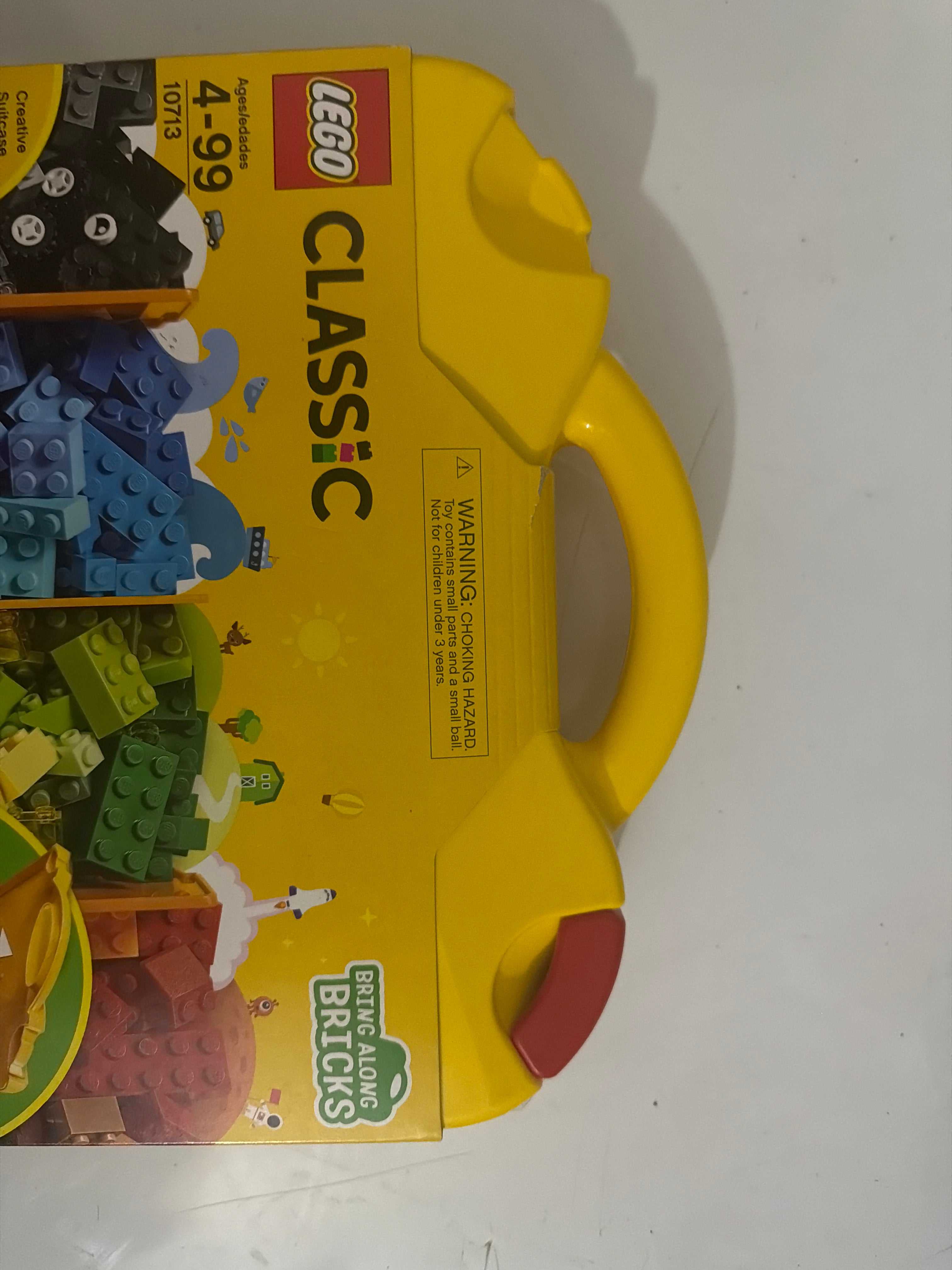 LEGO Classic 10713 – Creative Suitcase. “Missing one red locking tab but is sealed set”